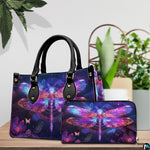 Side view of neon dragonfly handbag showing continuous celestial glowing artwork on side panel
