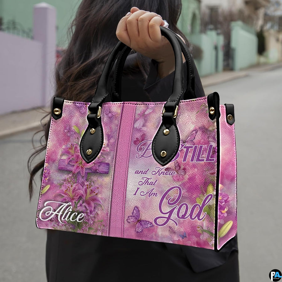 Arrangement of pink handbag and wallet presenting the unified floral cross theme.