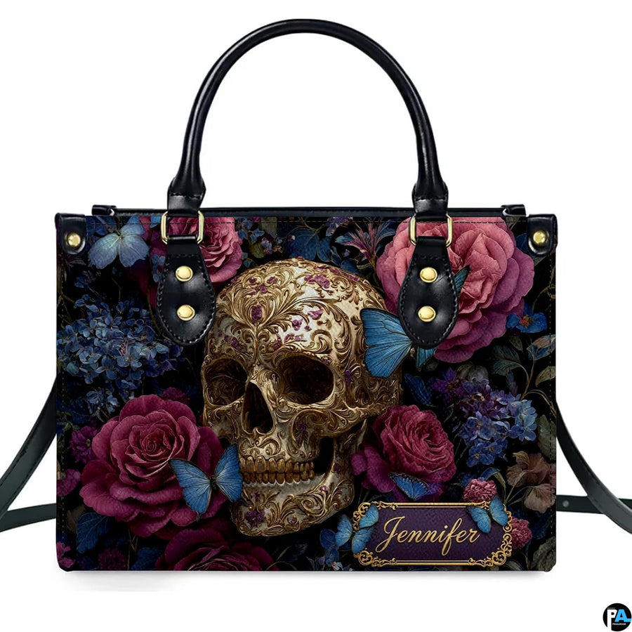 Gothic filigree skull rose handbag displayed alone on white studio background.