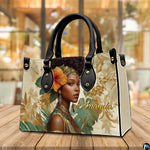Perspective tabletop presentation of tropical afro portrait artwork resting on natural wood.