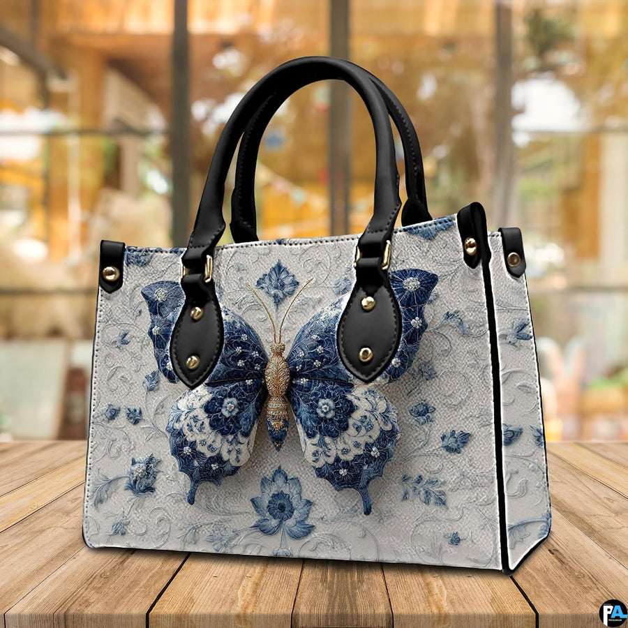Back view of porcelain butterfly handbag displaying white embossed floral textured exterior
