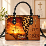 Easter sunrise cross handbag resting on a marble surface near a decorative candle.