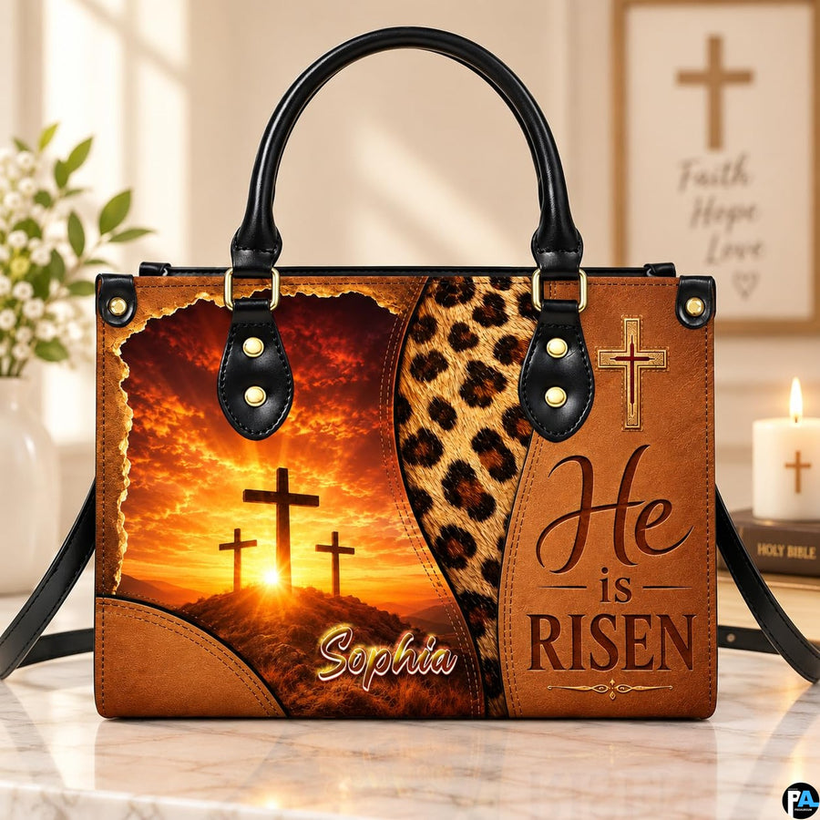 Easter sunrise cross handbag resting on a marble surface near a decorative candle.
