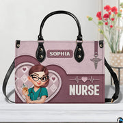 Chibi nurse pink quilted heart handbag displayed indoors alongside floral vase with texture swatch.