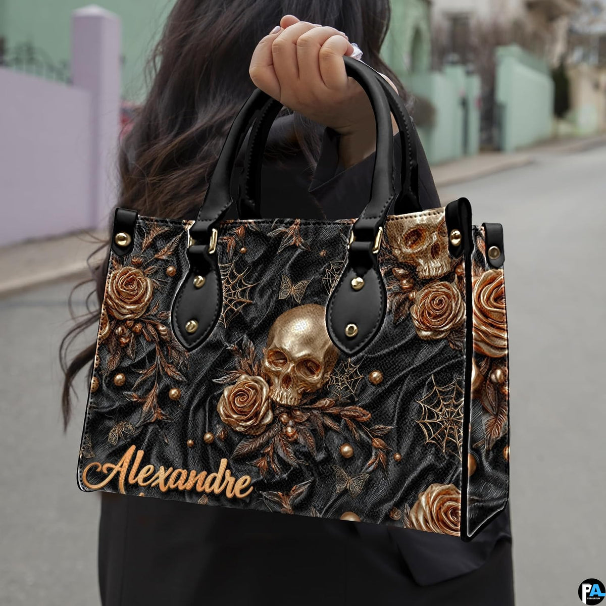 Golden skull handbag carried outdoors by top handle along residential street.