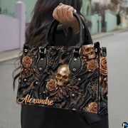 Golden skull handbag carried outdoors by top handle along residential street.