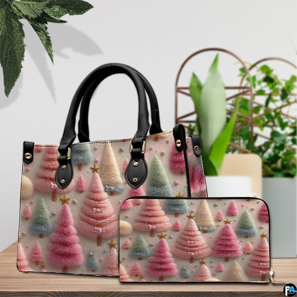 Tabletop scene showcasing whimsical pastel holiday trees pattern beside green foliage