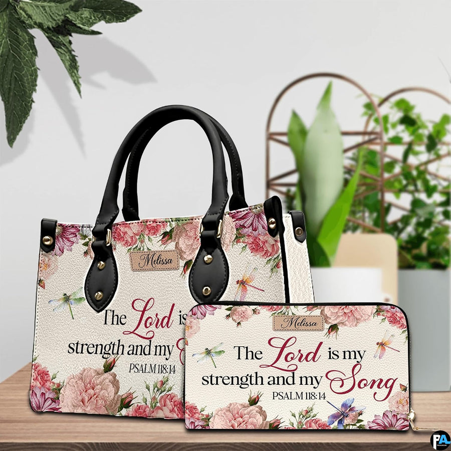Scripture floral dragonfly handbag and matching wallet set on wooden table near houseplant.