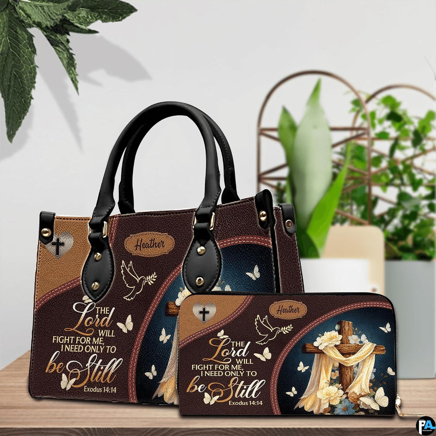 Christian wooden cross handbag and matching wallet set on wooden table near houseplant.