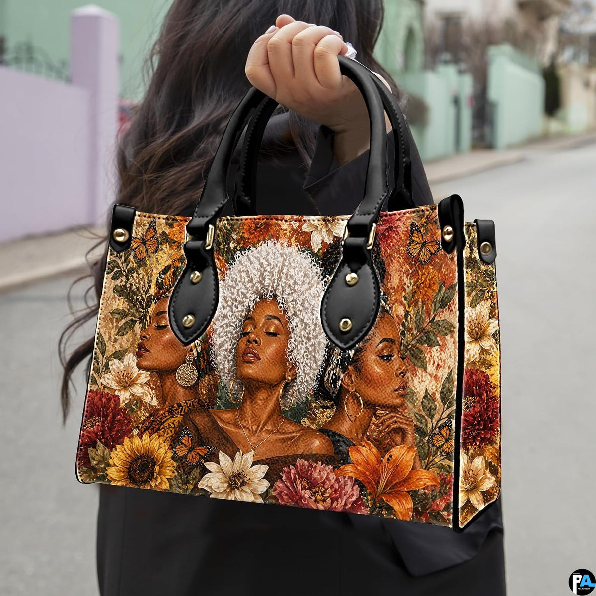 Outdoor presentation showing the floral sisterhood artwork held by pedestrian along sidewalk.