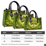 Three proportion views of shamrock handbag with gold ornament