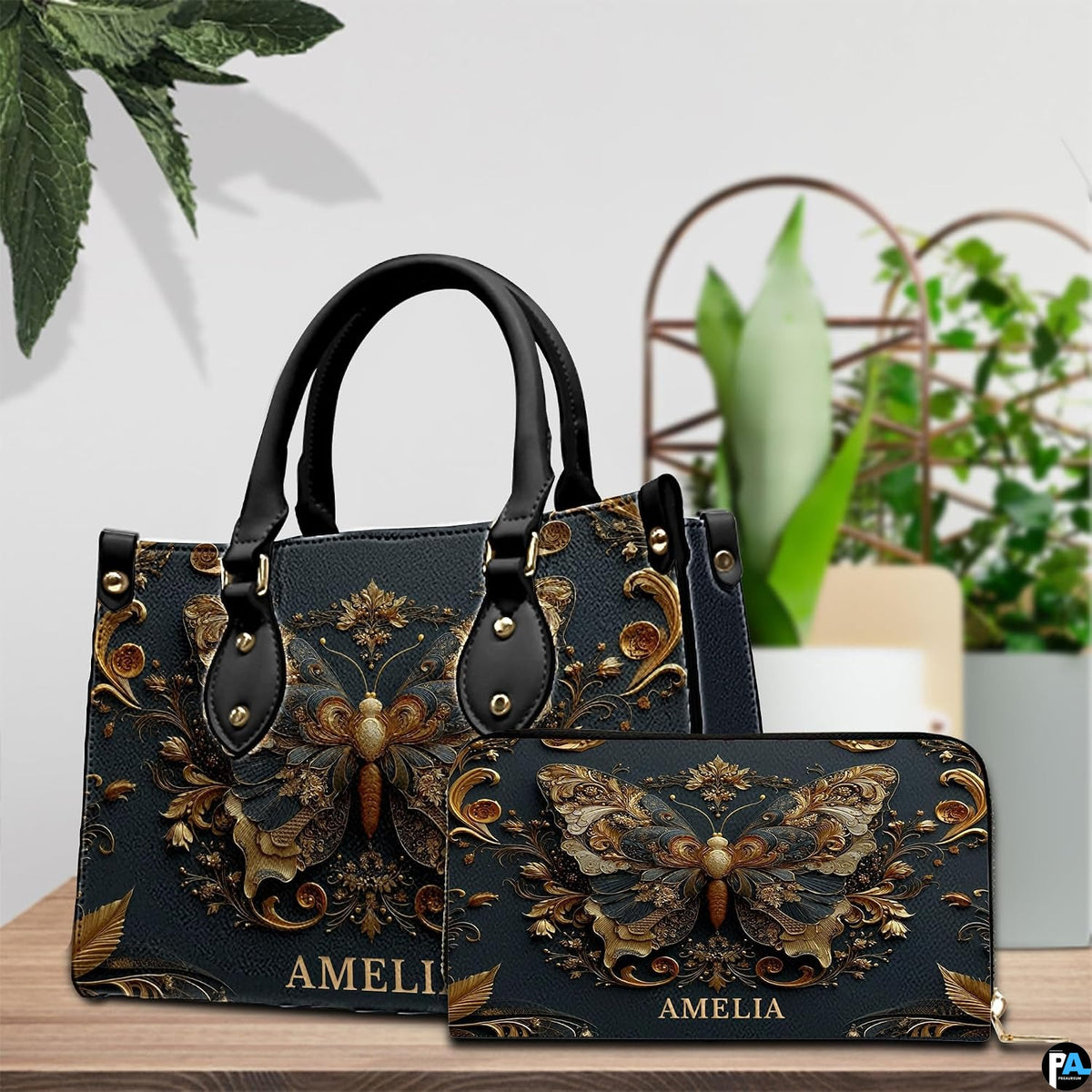 Tabletop display showing antique gold butterfly handbag and matching wallet beside indoor plants