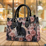 Alternative angle display of black kitten rose relief handbag and wallet set