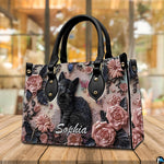 Alternative angle display of black kitten rose relief handbag and wallet set