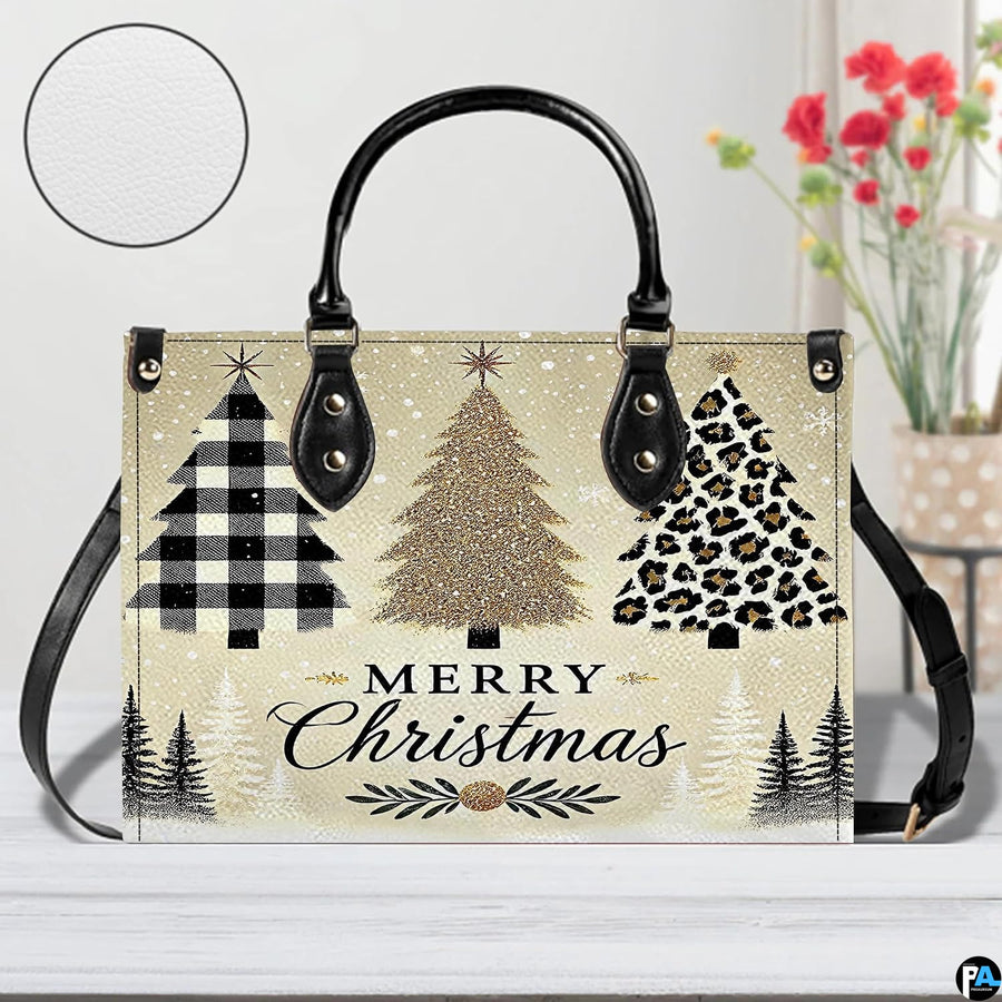 Angled display showing holiday tree handbag beside matching personal organizer