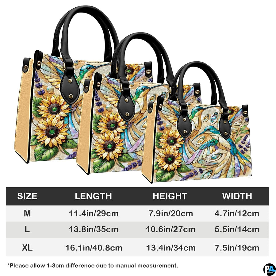 Complete set presentation of turquoise hummingbird and sunflower handbag and wallet on neutral backdrop.