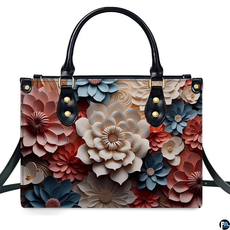 Demonstration of layered 3D paper cut floral blossom artwork on upright handbag.