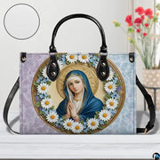 Side view of dual-tone damask Virgin Mary handbag