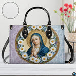 Side view of dual-tone damask Virgin Mary handbag
