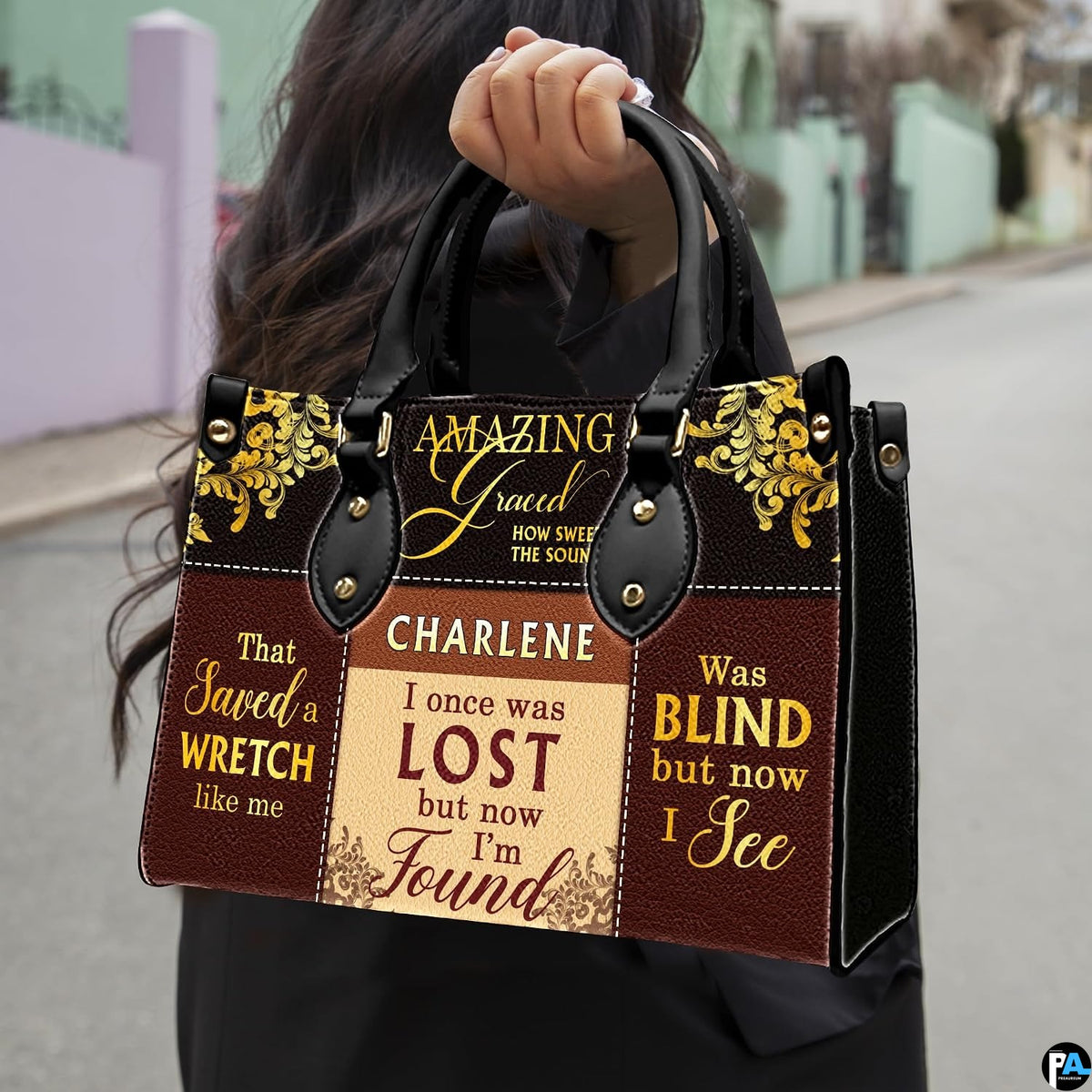 Model carrying Christian hymn patchwork handbag along city street
