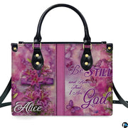 Side profile view of structured pink handbag showing sleek silhouette and black carrying handles.
