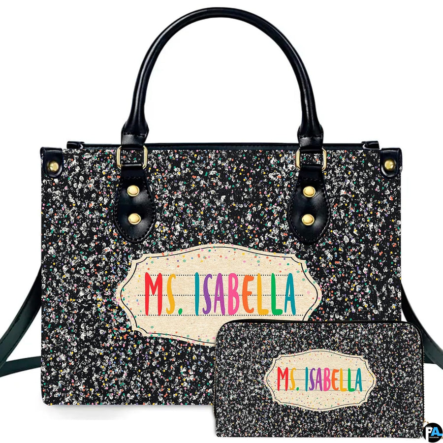 Front view showing teacher appreciation artwork on dark glitter surface alongside colorful label.