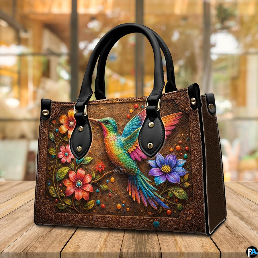 Handbag displayed in interior setting with floral arrangement and circular texture close-up inset.