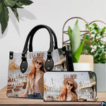 Autumn cafe portrait handbag and matching wallet placed on wooden table beside houseplant.