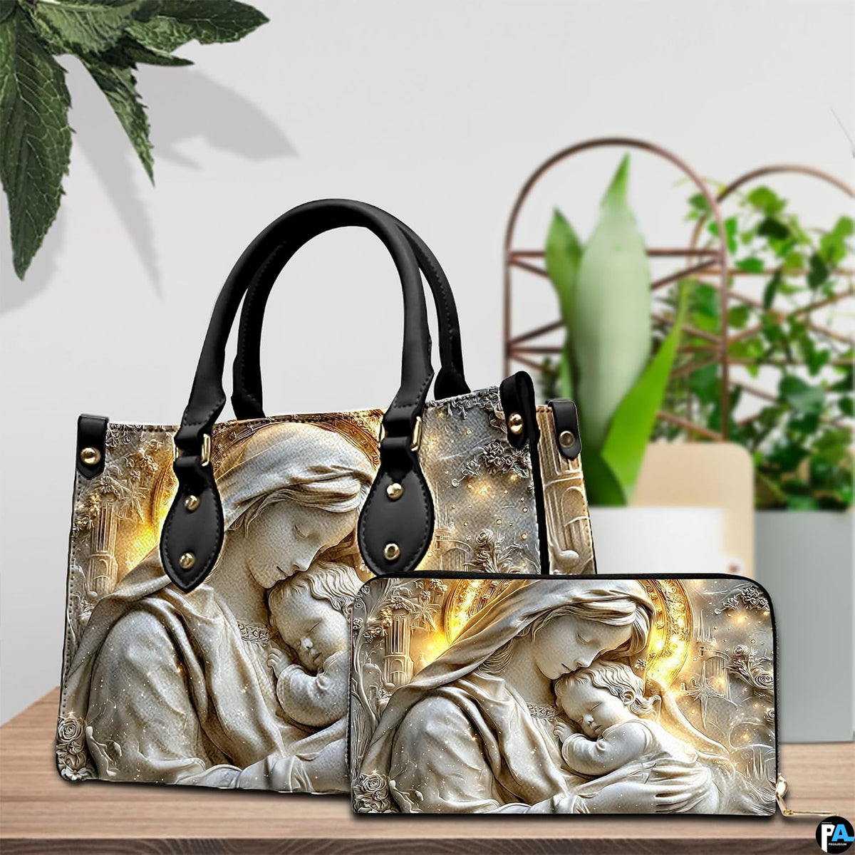 Tabletop display showing carved Madonna handbag and matching wallet beside potted house plants.