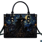 Gothic witch crystal ball raven handbag displayed alone on white background.