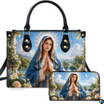 Pastoral Virgin Mary handbag and matching wallet set on marble terrace with landscape