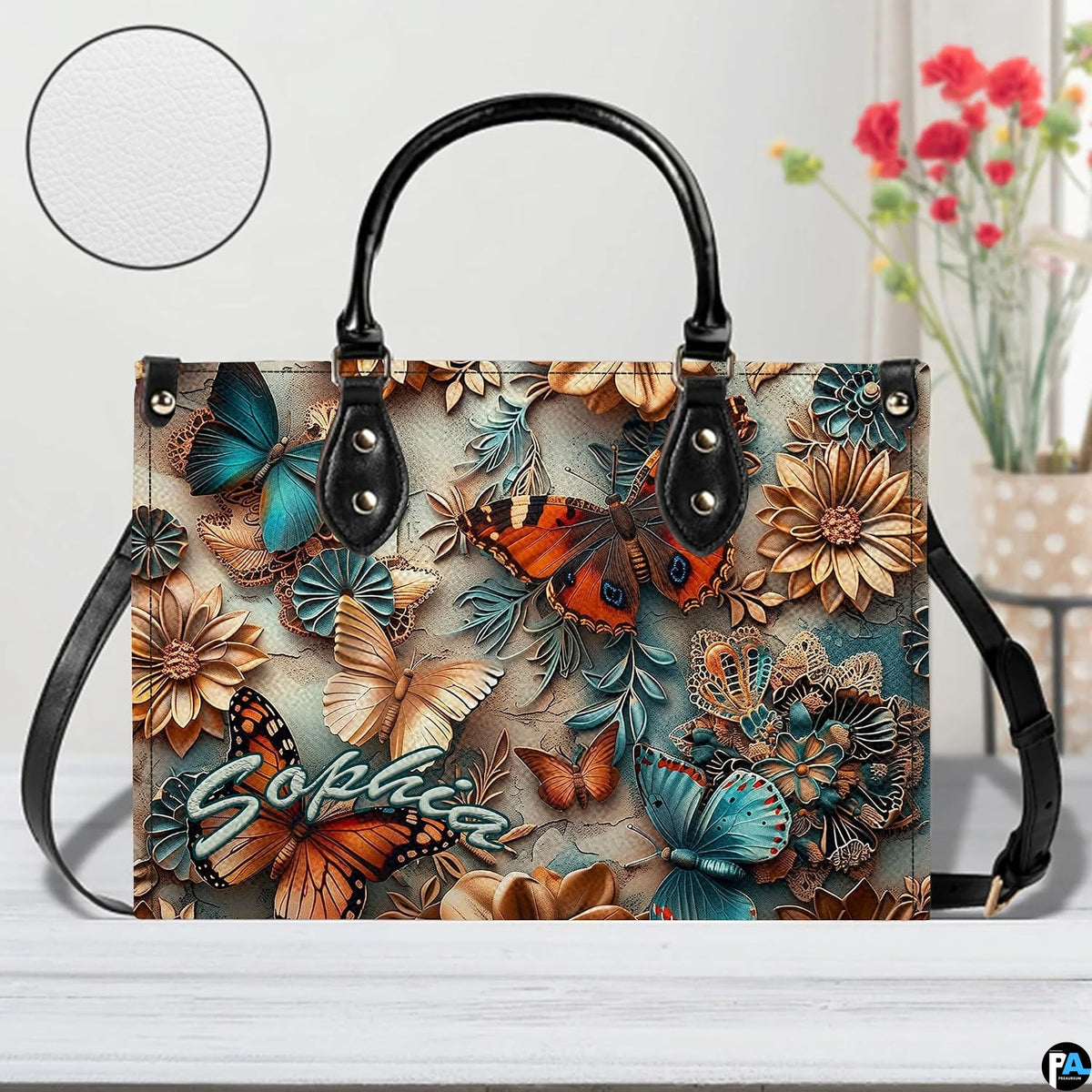 Close-up front view of matching zippered wallet showing butterfly relief