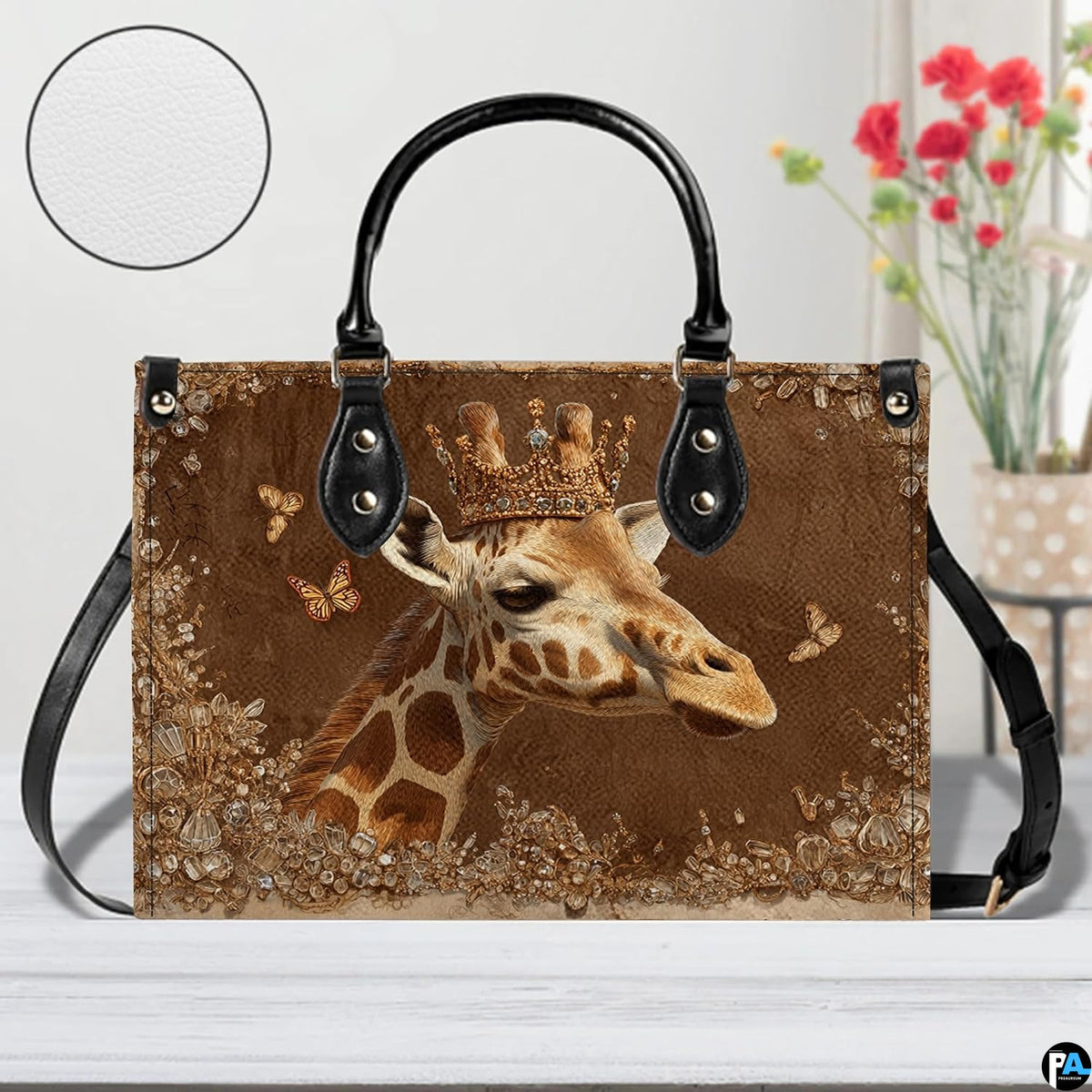 Angle perspective view of the giraffe handbag showcasing side depth and textured bronze print.