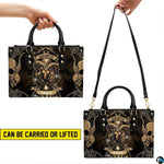 Carrying options demonstrated for the Gothic Ram Zodiac Handbag showing top handle and shoulder wear.