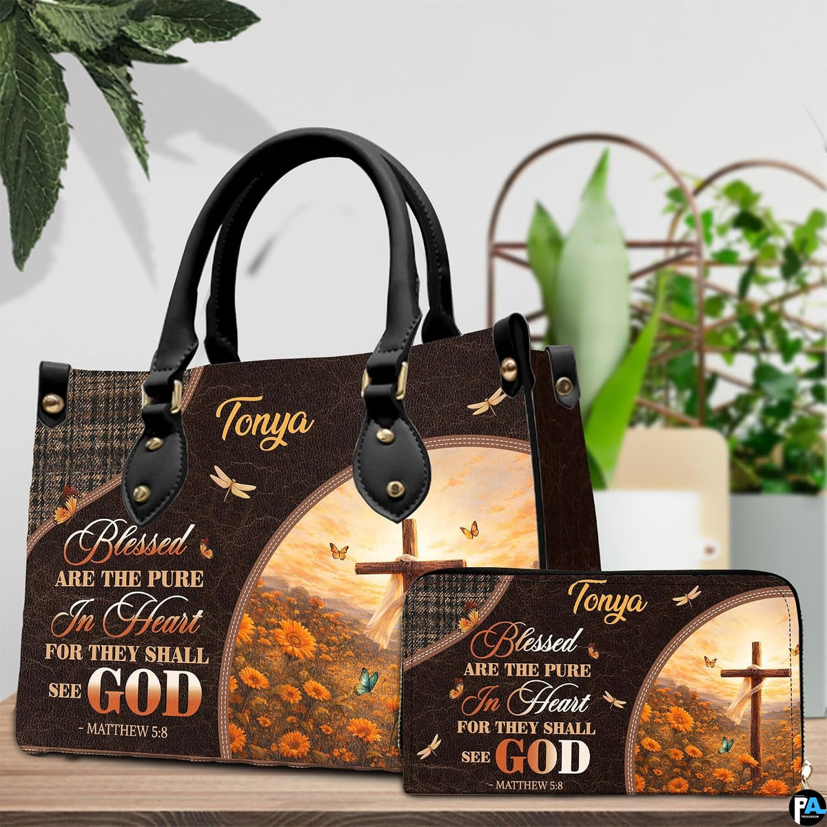 Detailed view of arched sunrise scene featuring wooden cross on flowering hillside on handbag.