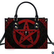 Gothic inverted crimson pentagram skull handbag shown alone on white background.