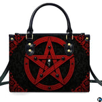 Gothic inverted crimson pentagram skull handbag shown alone on white background.