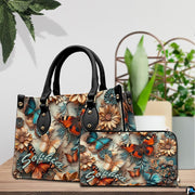 Close-up front view of handbag showing sculpted butterflies and daisies