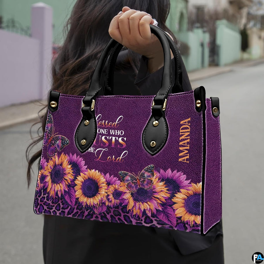 Angled display showing purple sunflower handbag beside matching personal organizer