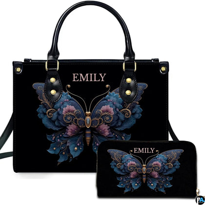 Front view of ornate floral butterfly handbag with matching zip wallet on solid black backdrop
