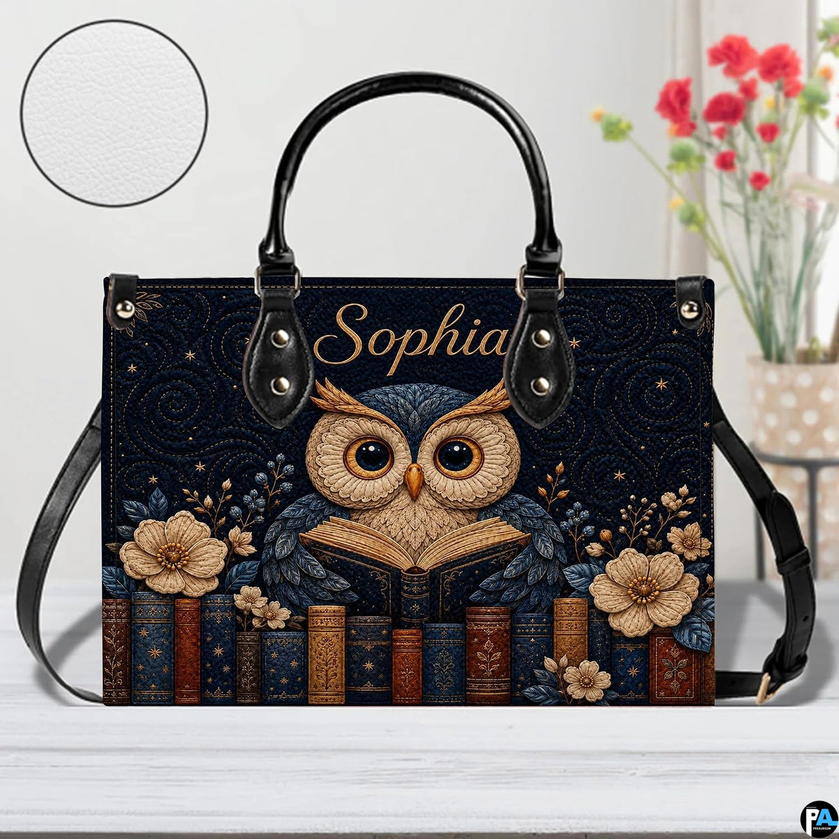 Angled view displaying the starry celestial reading owl artwork on the structured handbag.