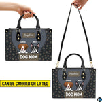 Front view of matching wallet showing cartoon dog illustrations and paw print side panels.