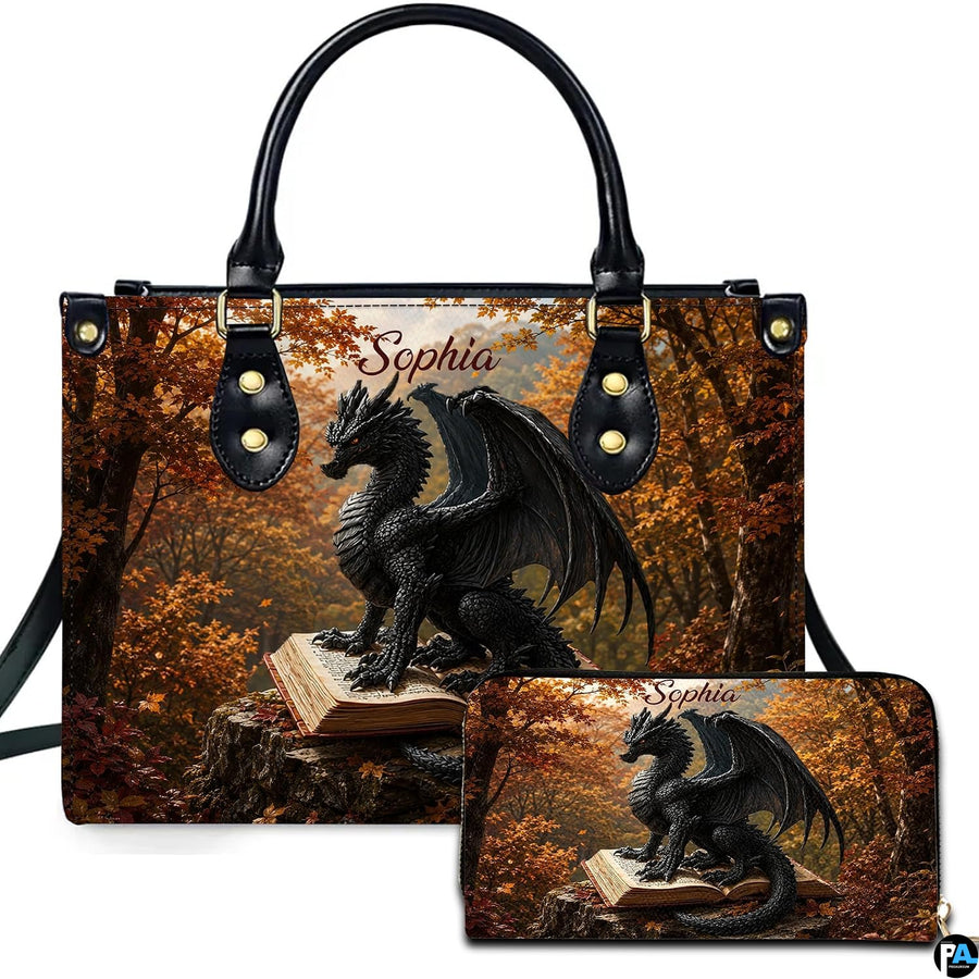 Front presentation showing a black horned dragon perched on an open antique book in an autumn woodland