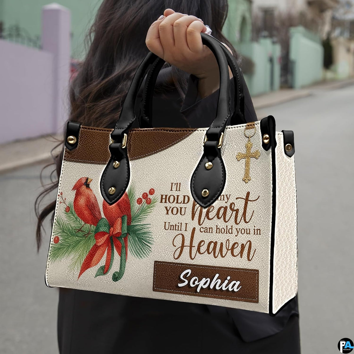 Outdoor lifestyle presentation showcasing the cardinal memorial handbag carried by an individual.