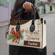 Outdoor lifestyle presentation showcasing the cardinal memorial handbag carried by an individual.