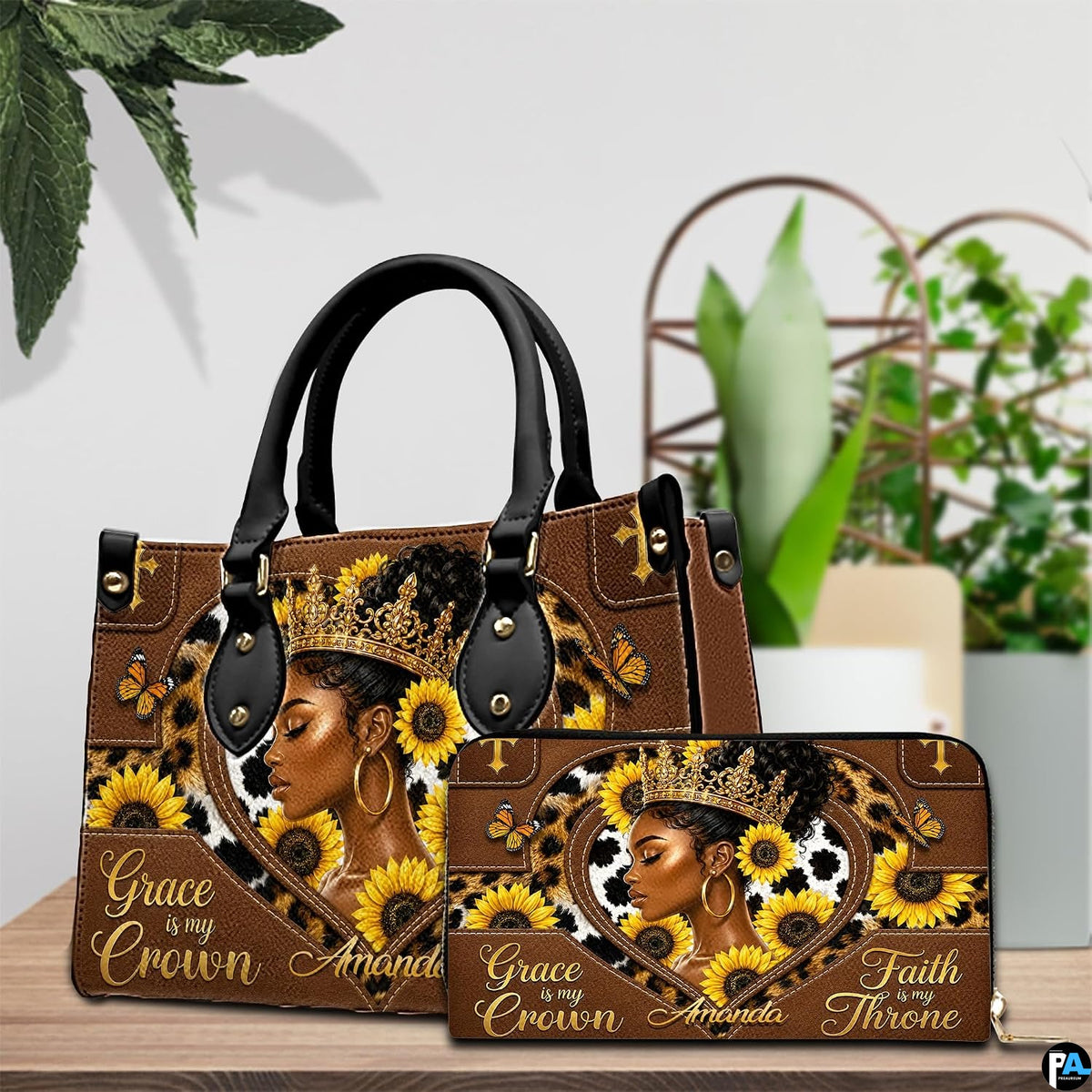 Coordinated indoor arrangement displaying queen sunflower artwork and companion accessory beside greenery.