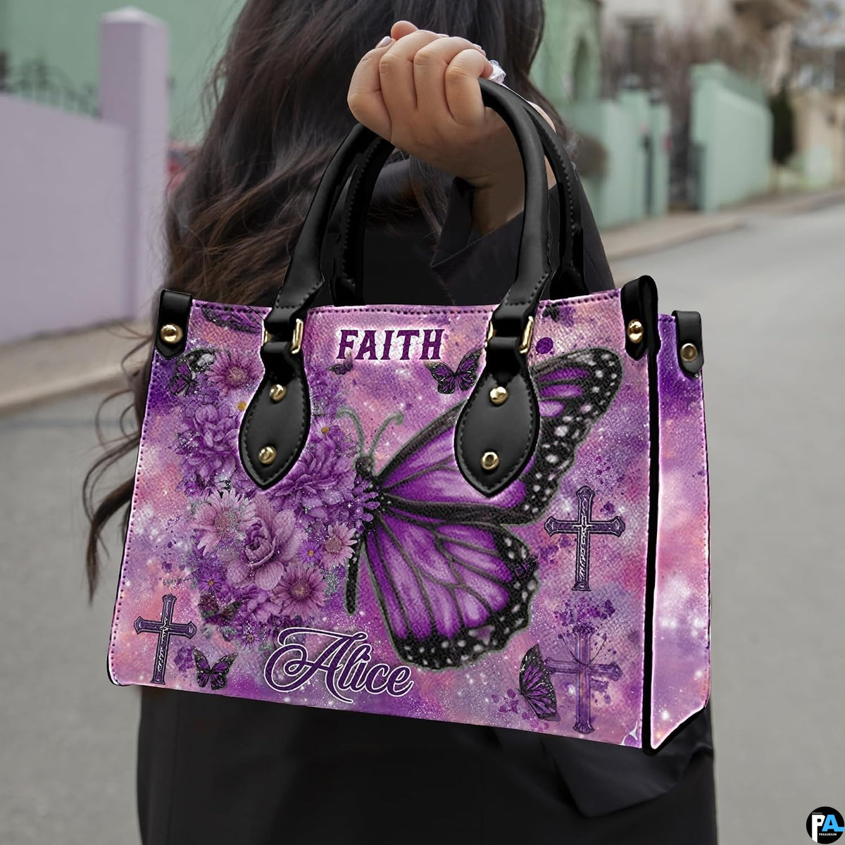 Front view of purple floral butterfly cross handbag showing blossom wing and cross graphics.