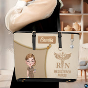 Model carrying the Beige Clinician Tote Handbag over shoulder in a neutral indoor room setting.