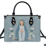 Front view of minimalist praying Virgin Mary watercolor handbag on white background
