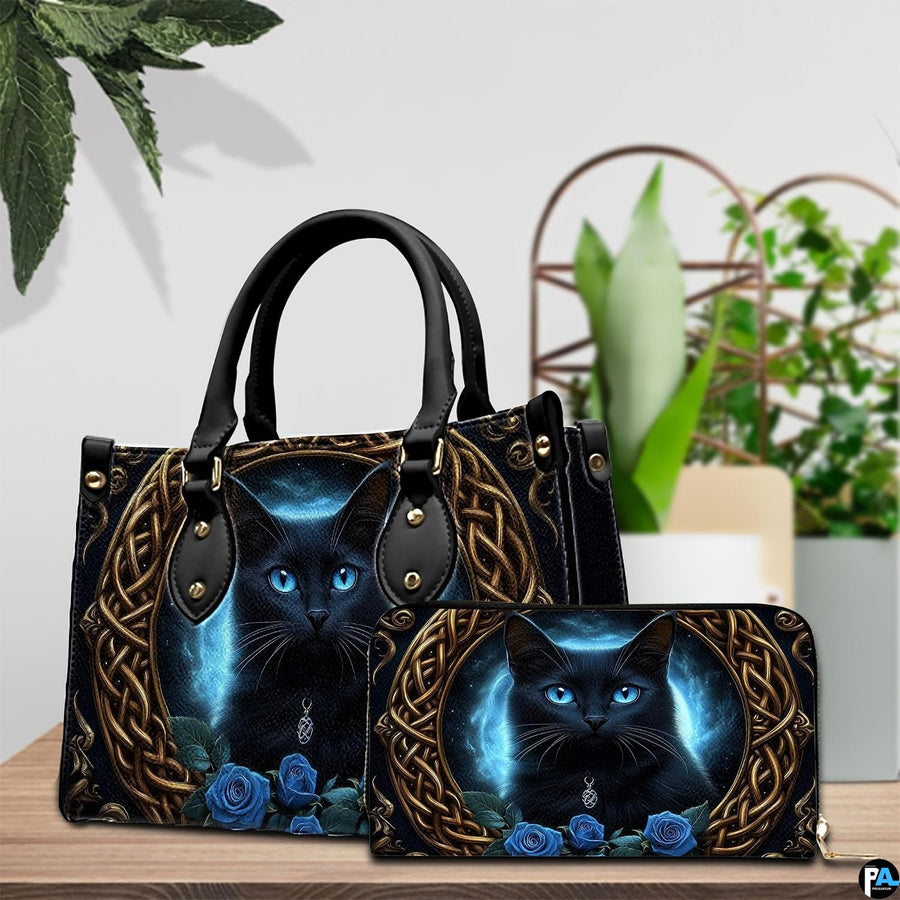 Indoor presentation of Celtic black cat artwork alongside matching companion accessory on wooden tabletop near plants.